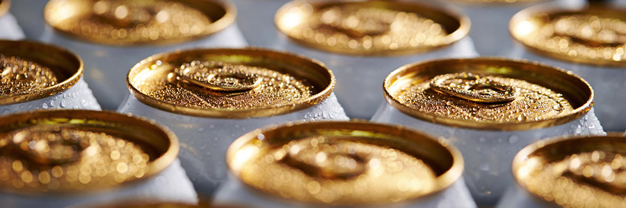 Close-up of the metal tops of a case of beverage cans.