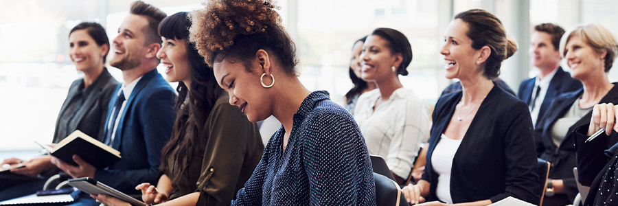 An amused audience in an office presentation 