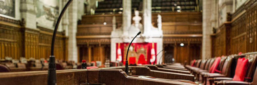 A close up of a desk in an empty Senate Chamber in the Parliament of Canada.