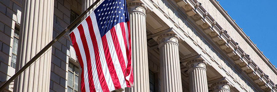 An American flag hanging outside a U.S. federal building