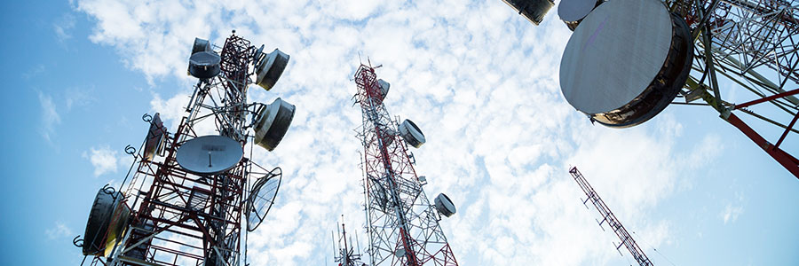 Looking upwards at wireless communications towers