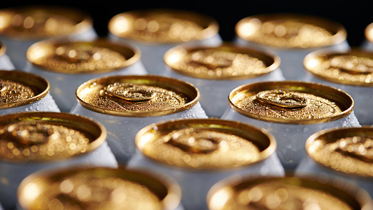 Close-up of the metal tops of a case of beer cans.