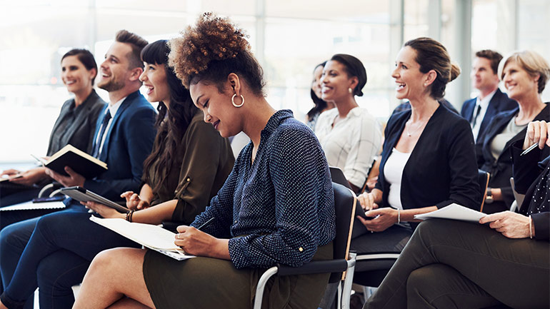 An amused audience in an office presentation