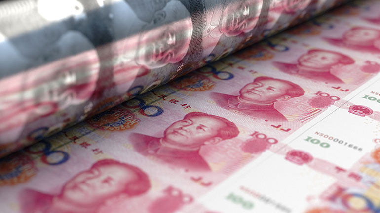 A close up of Chinese Yuan bills being printed.